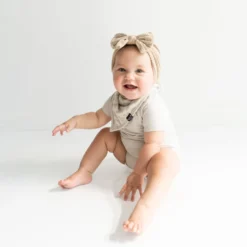 Bib In Oat Leopard -Kyte Baby Shop kyte baby bib oat leopard bib in oat leopard 32329612197999 scaled